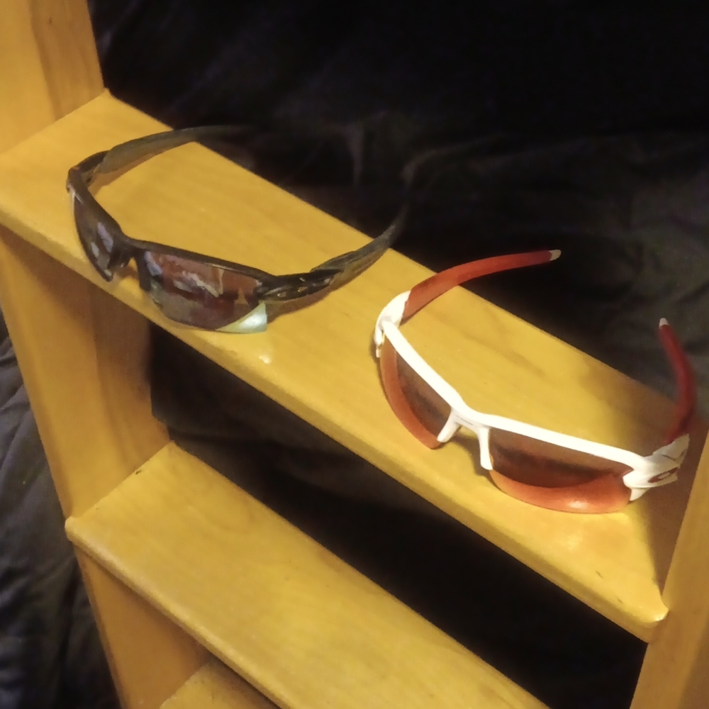 2 pairs of Oakley sunglasses